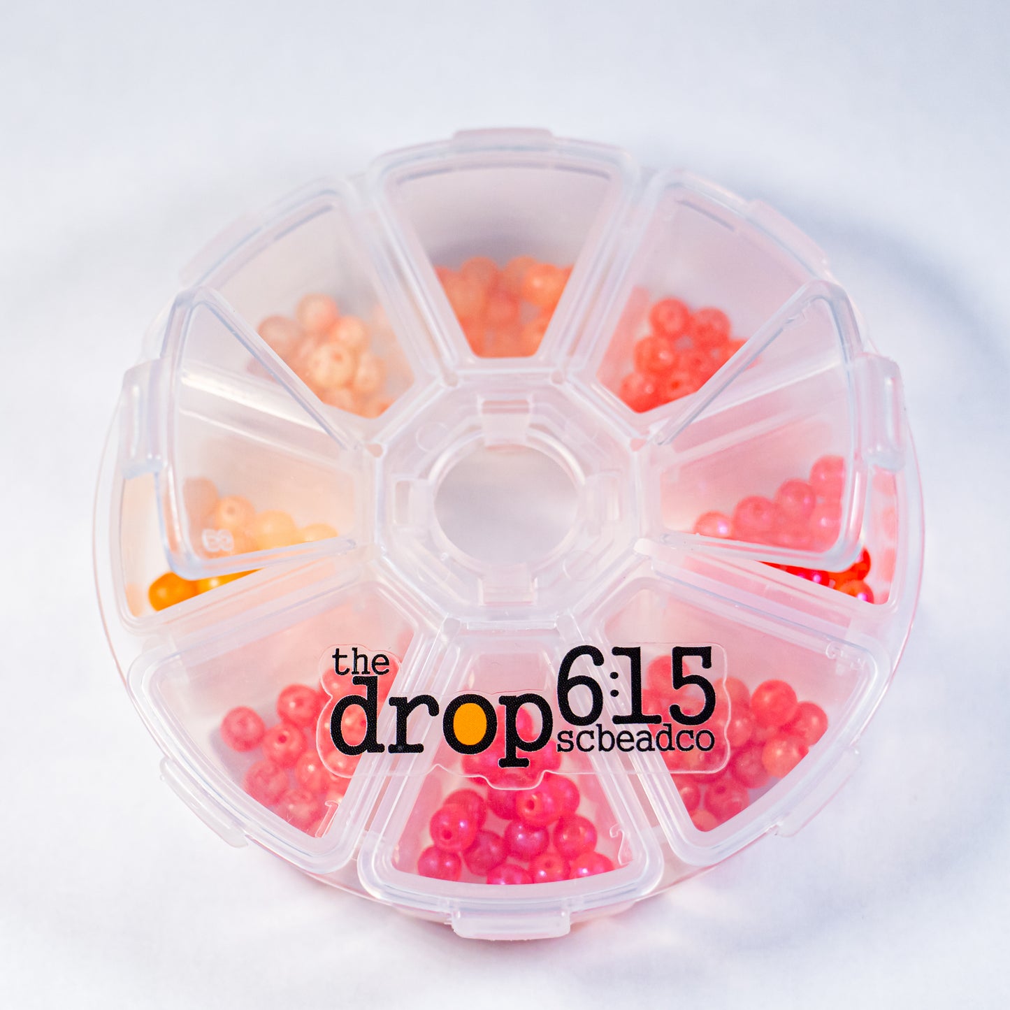 Small bead fishing kit with clear case and 8 colorful beads displayed inside