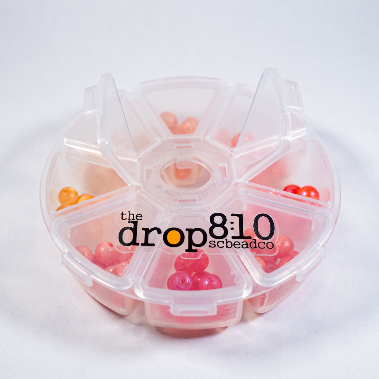 Small bead fishing kit with clear case and 8 colorful beads displayed inside