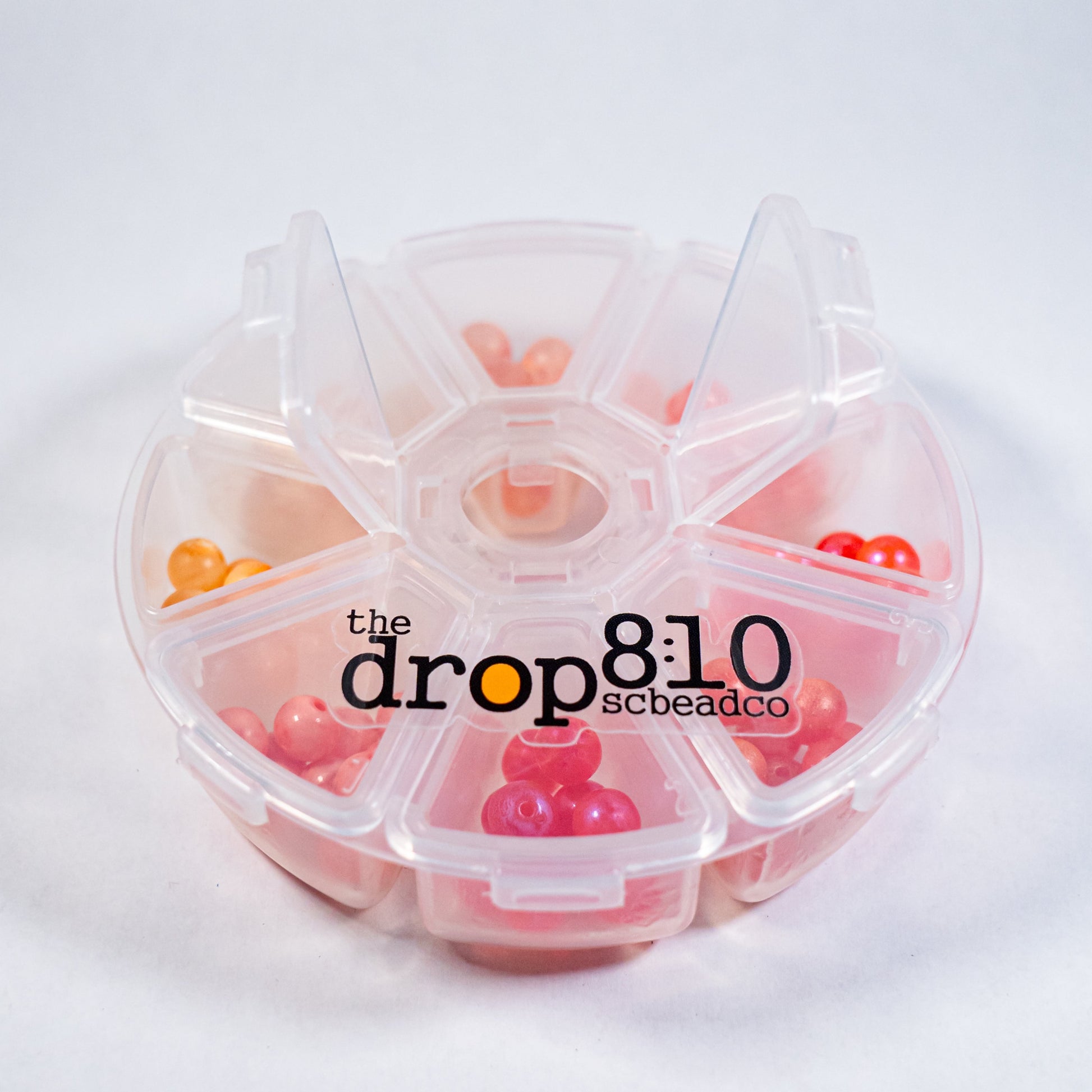 Small bead fishing kit with clear case and 8 colorful beads displayed inside